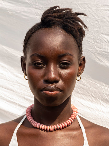 Elegant statement necklace featuring hand-selected vibrant beads and sustainable gold-plated brass.