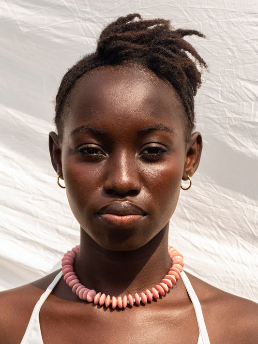 Elegant statement necklace featuring hand-selected vibrant beads and sustainable gold-plated brass.