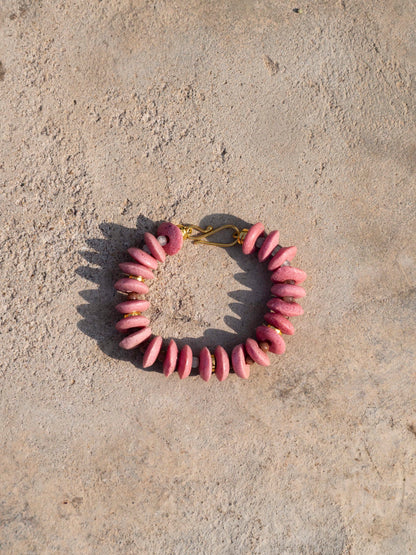 Elegant statement necklace featuring hand-selected vibrant beads and sustainable gold-plated brass.