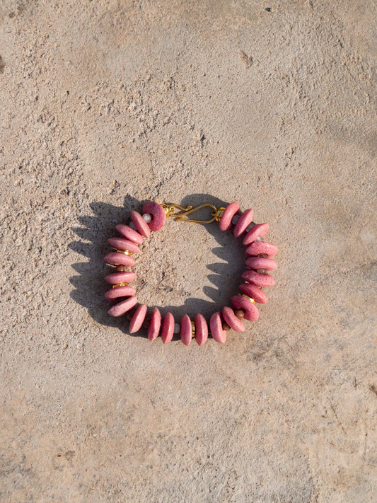 Elegant statement necklace featuring hand-selected vibrant beads and sustainable gold-plated brass.