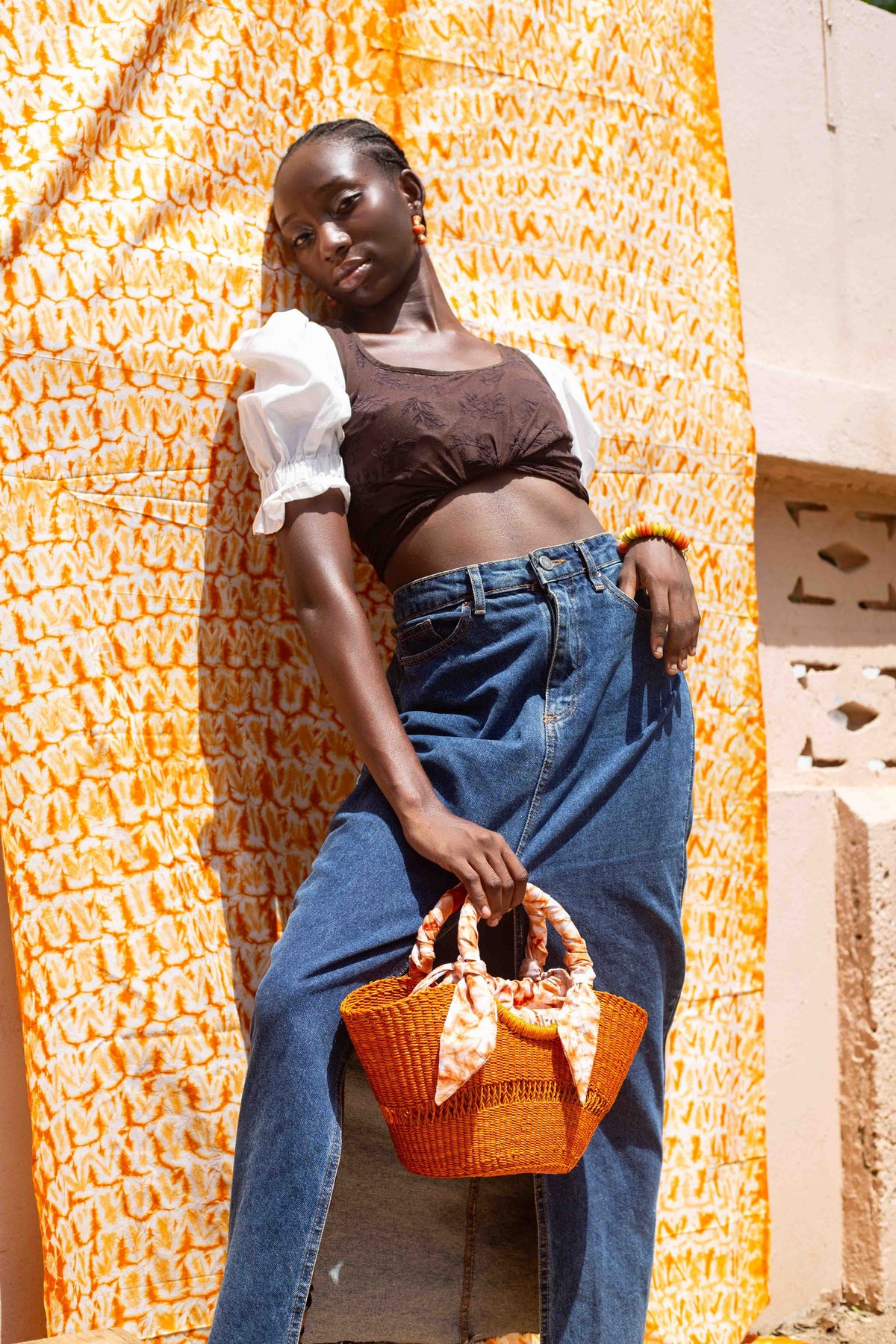Natural fiber beach bag with a boho-chic design, handcrafted by artisans.