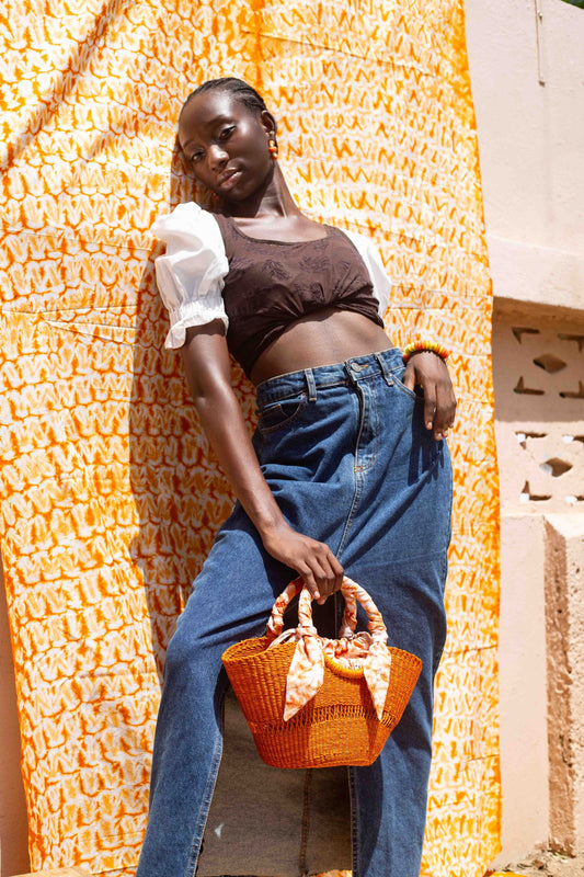Natural fiber beach bag with a boho-chic design, handcrafted by artisans.