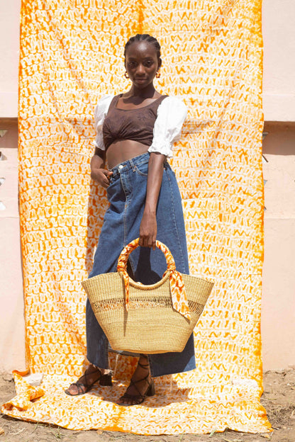 Ethically made tote bag from Ghana, combining traditional weaving and tie-dye fabric.