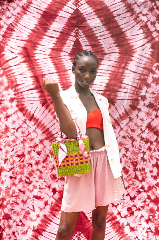Tiny square shaped bag from Ghana, combining traditional weaving and tie-dye fabric.