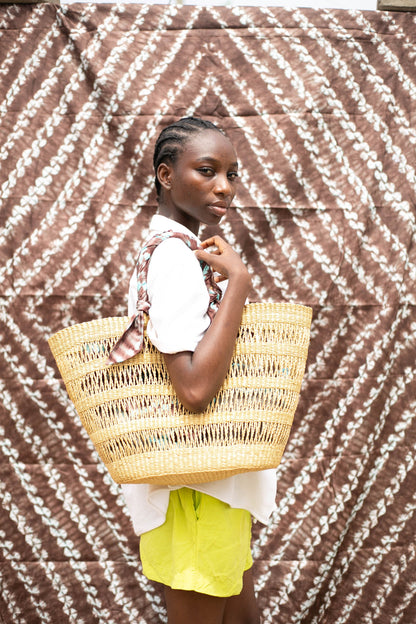 Handwoven tote bag, sustainably crafted by artisans in Ghana.