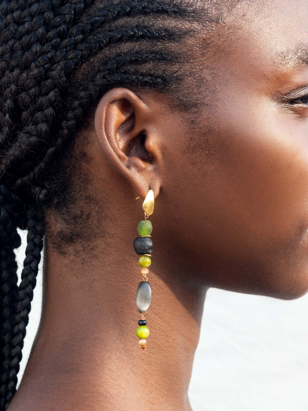 Statement earrings with bold, hand-painted glass beads and elegant gold-plated accents.