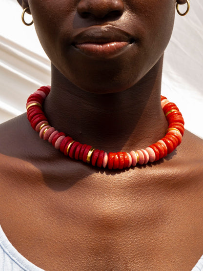 Modern Ghanaian necklace with striking, colorful recycled glass beads and a gold-plated chain.