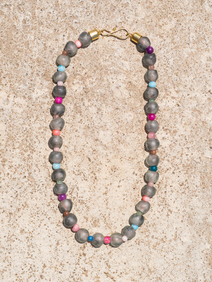 Minimalist artisan necklace with handcrafted glass beads and a gold-plated details.