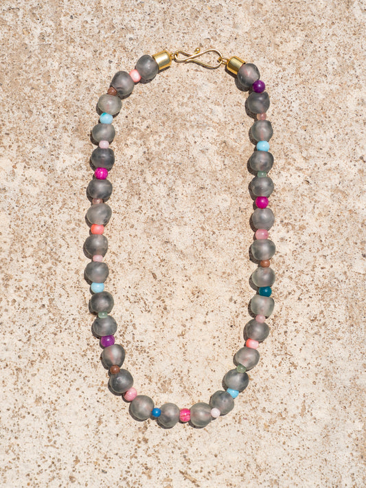 Minimalist artisan necklace with handcrafted glass beads and a gold-plated details.