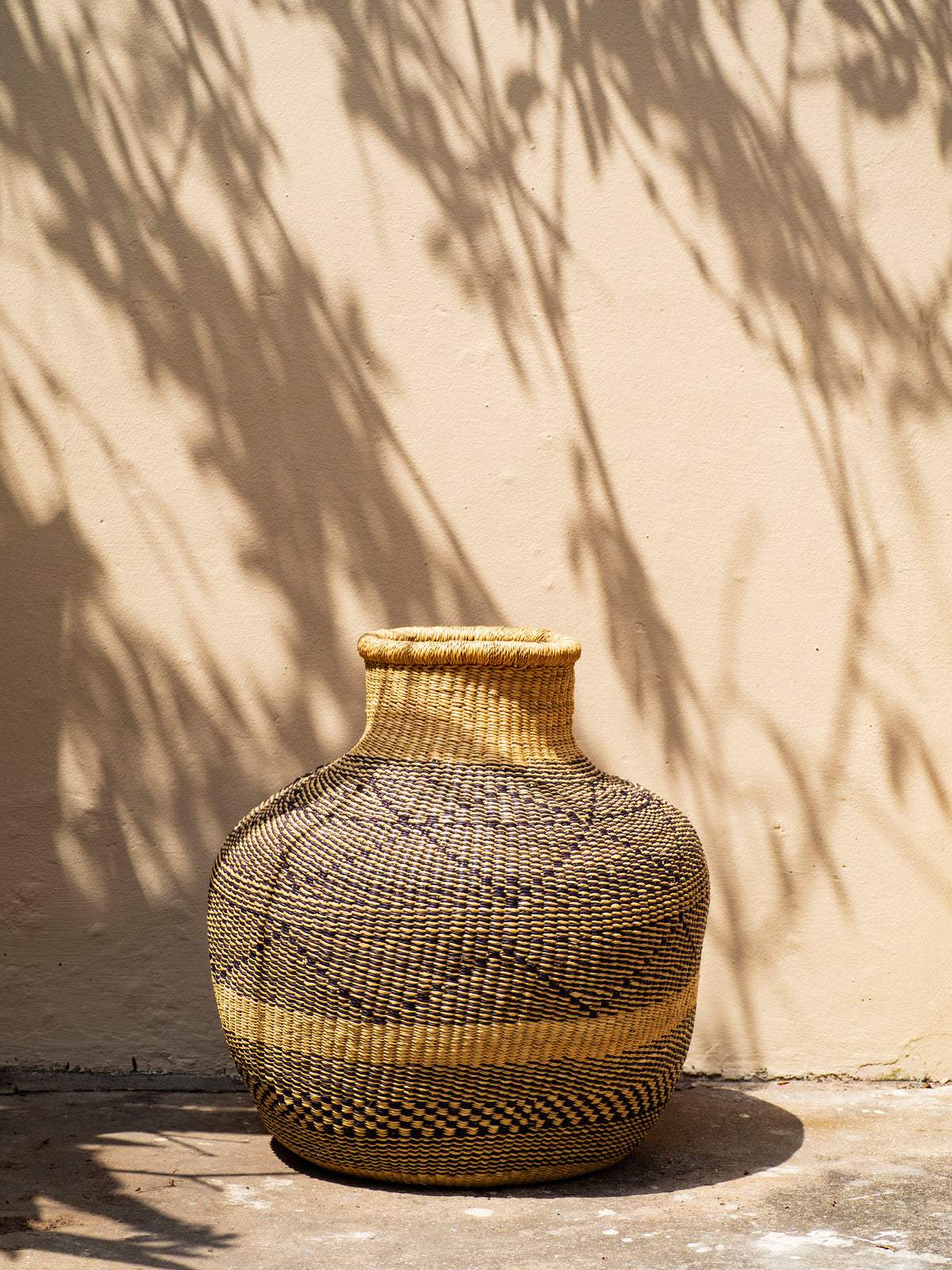 Decorative woven art basket with intricate patterns, ideal for modern home decor.