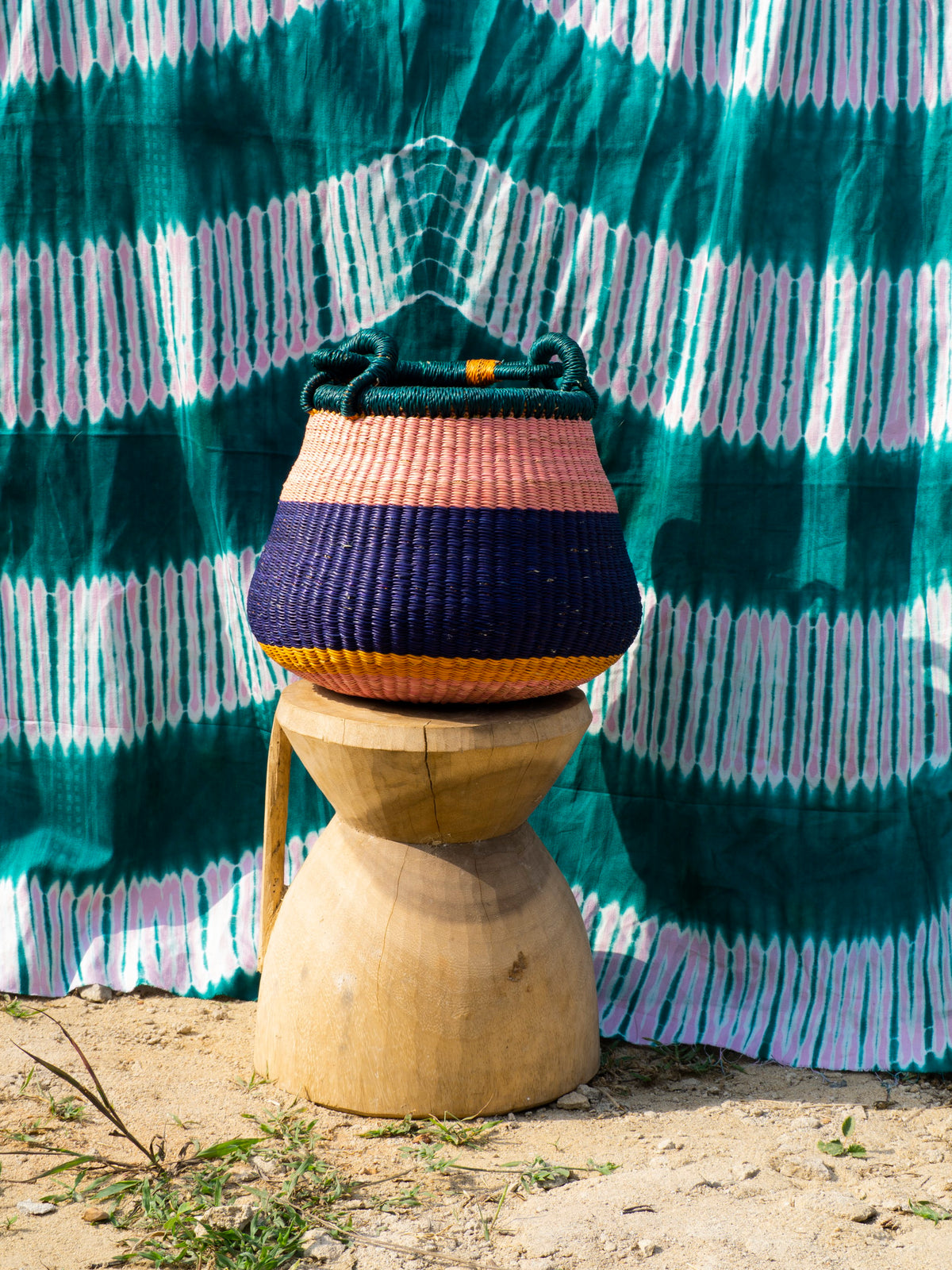 Handwoven storage basket in bold colours, perfect for kids room.