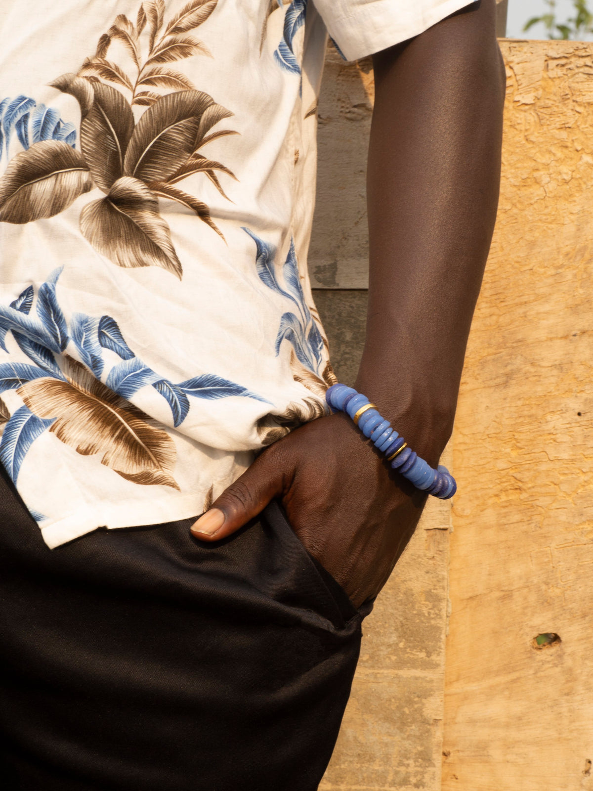 Luxurious beaded bracelet featuring vibrant recycled glass and polished gold-plated details, made in Ghana.