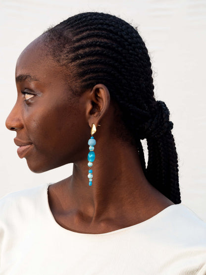 Luxurious handcrafted earrings with vibrant recycled glass beads and gold-plated brass, made in Ghana.