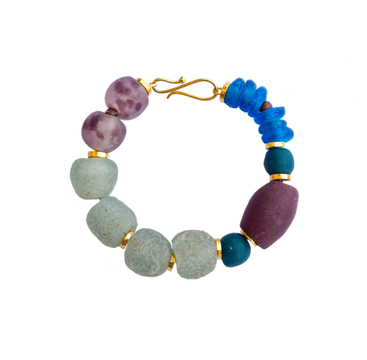 Elegant statement bracelet featuring hand-selected vibrant beads and sustainable gold-plated brass.