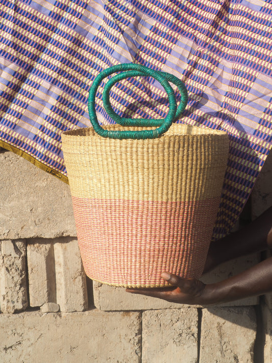 Handwoven storage basket made from natural fibers, perfect for home organization.
