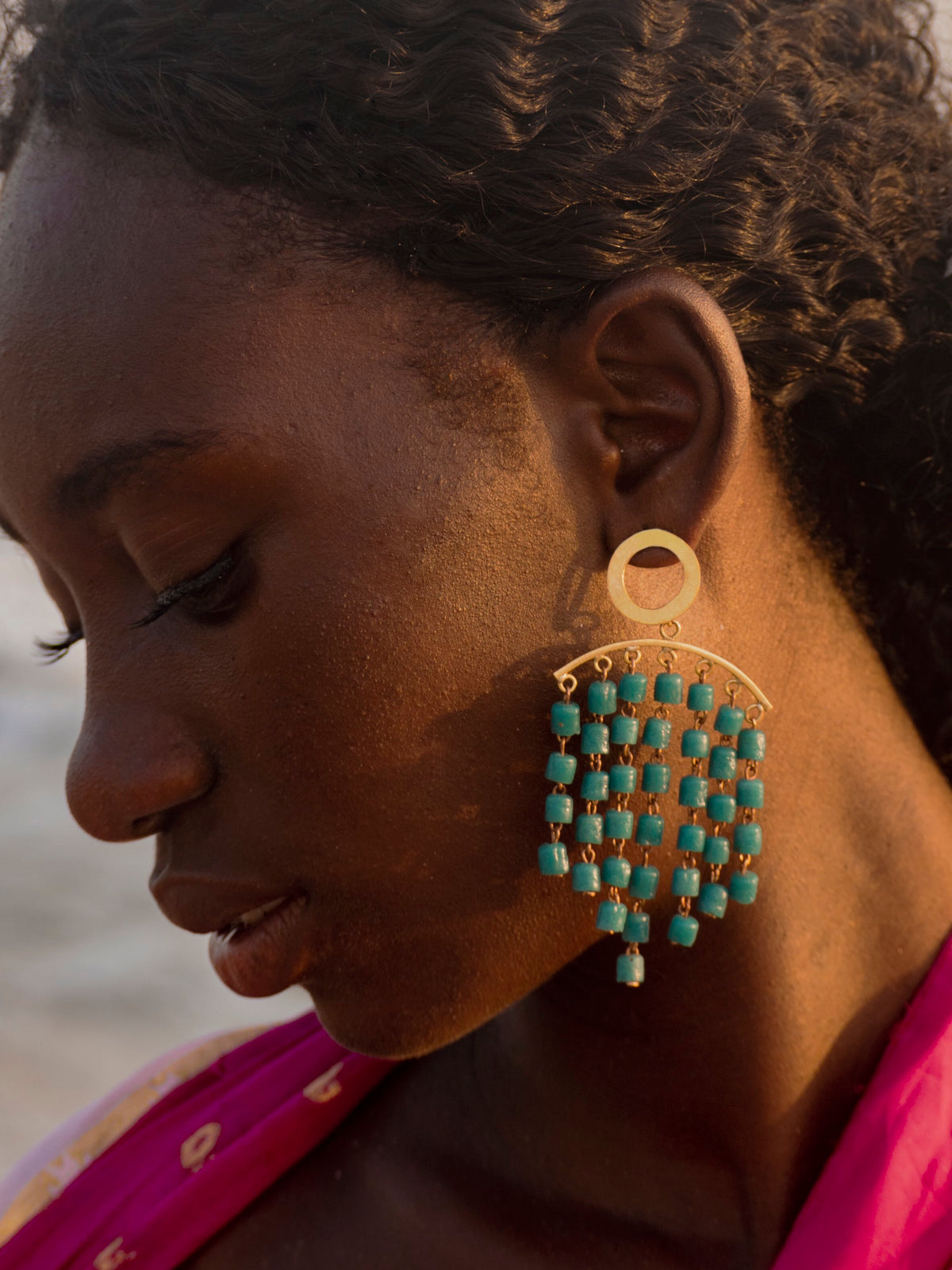 Modern artisan earrings featuring colorful Ghanaian glass beads and 18K gold-plated brass.
