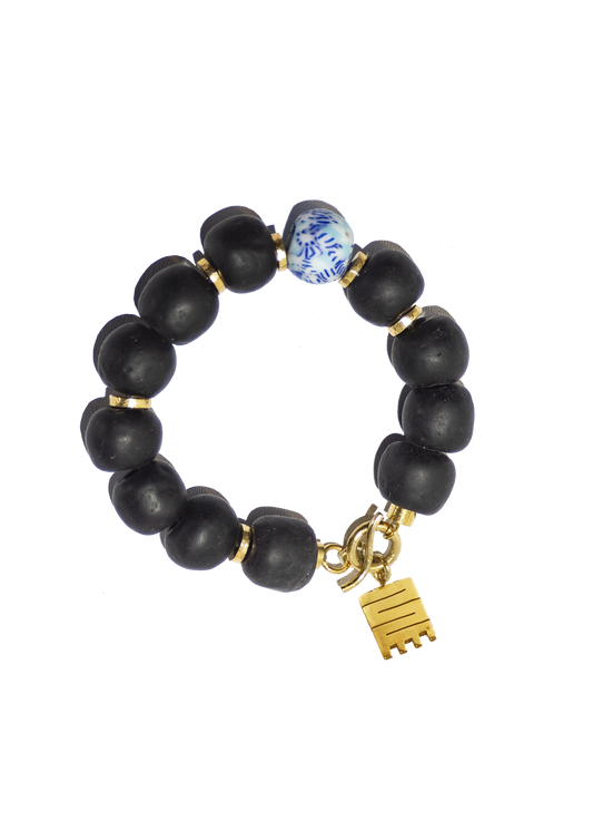 Sustainably crafted Ghanaian bracelet featuring bold, artistic glass beads and a gold-plated Adinkra charm